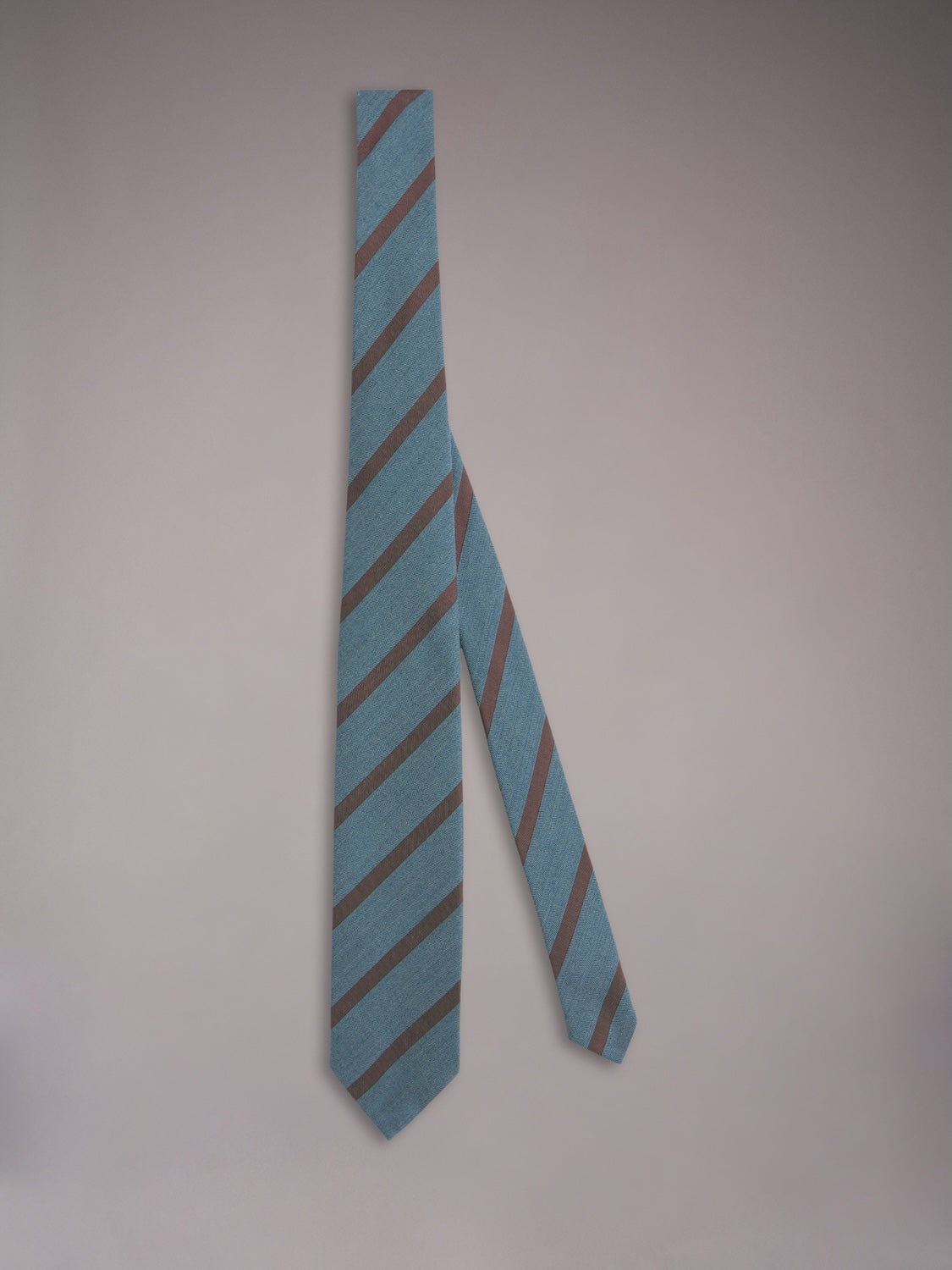 Seven-fold tie in blue wool, cotton and silk with a regimental motif