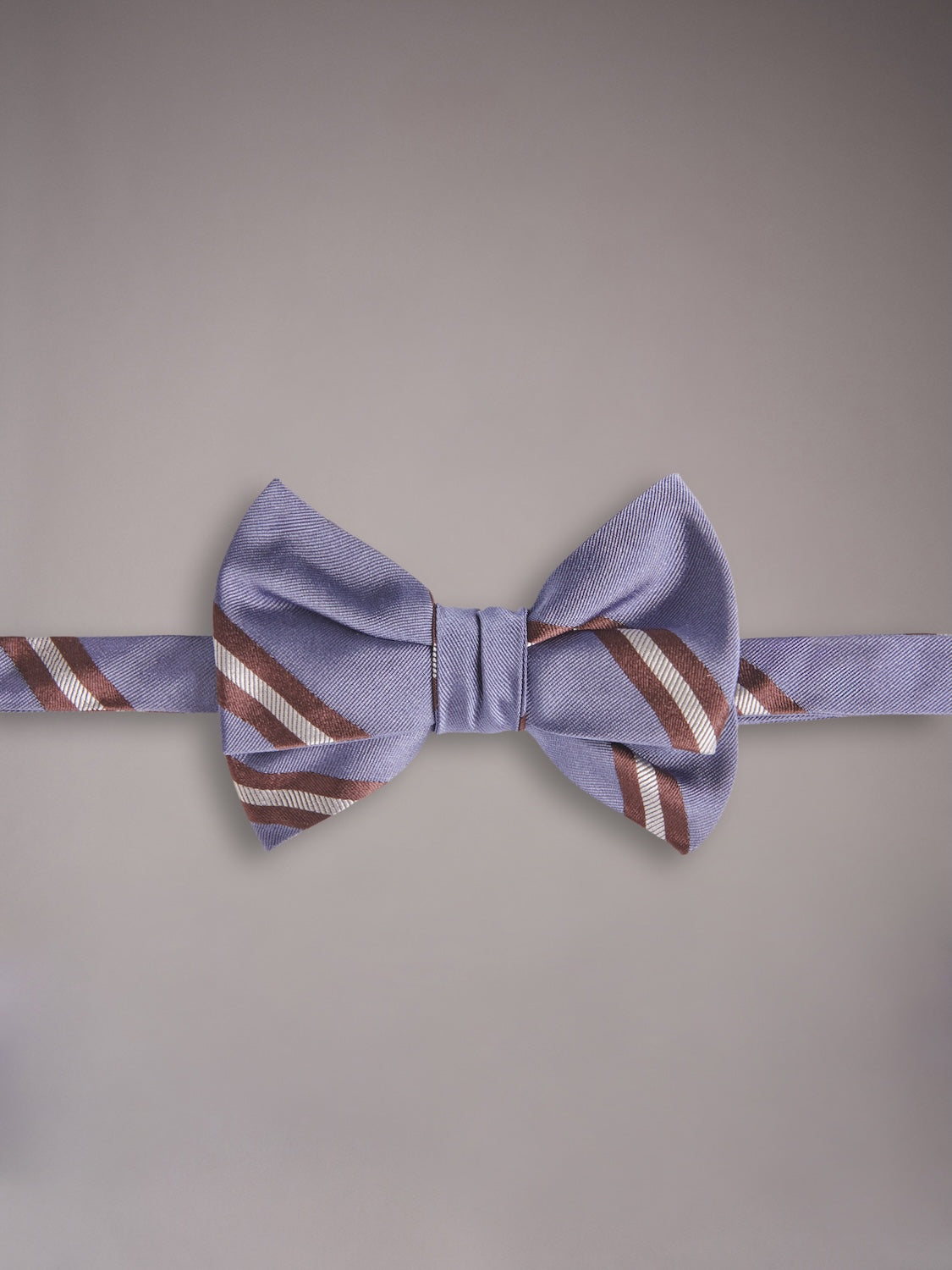 Self-tie bow tie in blue silk with a regimental motif